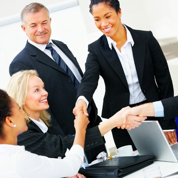 Professional office workers laughing