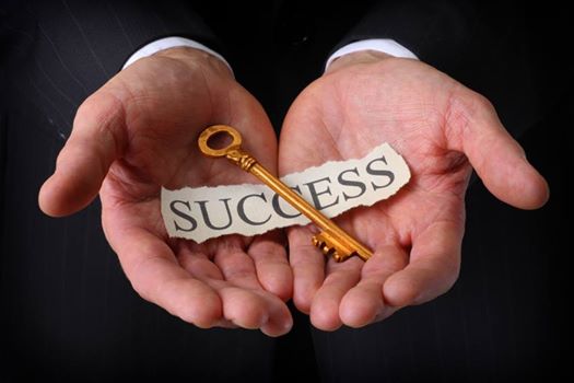 hands-holding-the-keys-to-success